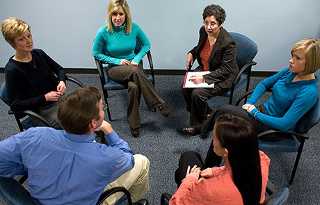Group therapy session with participants in a circle